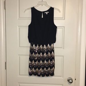 Black and gold sequined dress